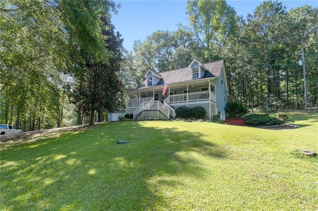 view of front of property featuring a front yard and a porch