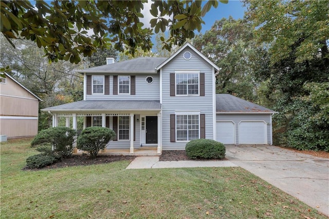 view of front of house featuring a front lawn and a garage