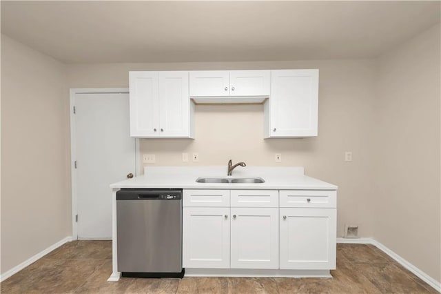 kitchen with dishwasher, white cabinetry, and sink