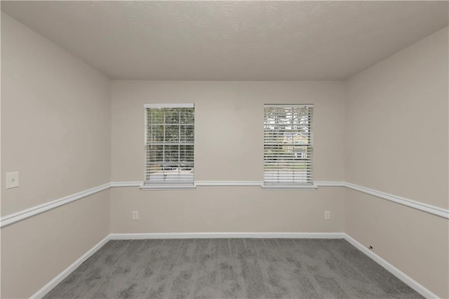 empty room with light colored carpet