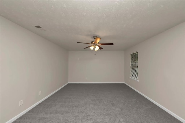 empty room featuring carpet, ceiling fan, and a textured ceiling