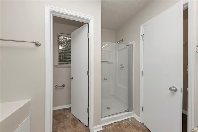 bathroom featuring a shower with shower door