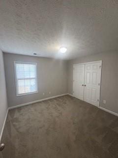 215 Bradley St, Covington, GA 30016 - carpeted empty room featuring a textured ceiling