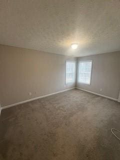 215 Bradley St, Covington, GA 30016 - empty room with dark carpet and a textured ceiling