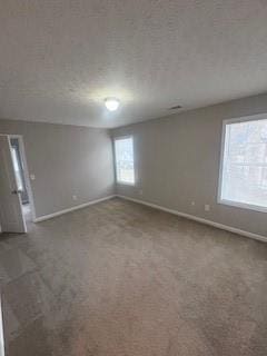 215 Bradley St, Covington, GA 30016 - carpeted empty room featuring a textured ceiling