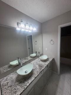 215 Bradley St, Covington, GA 30016 - bathroom with vanity and a textured ceiling