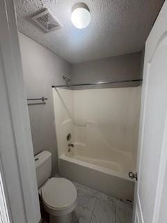 215 Bradley St, Covington, GA 30016 - bathroom featuring washtub / shower combination, a textured ceiling, and toilet