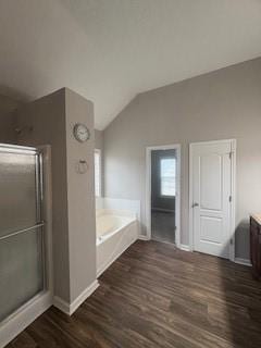 215 Bradley St, Covington, GA 30016 - bathroom featuring vanity, separate shower and tub, hardwood / wood-style floors, and lofted ceiling