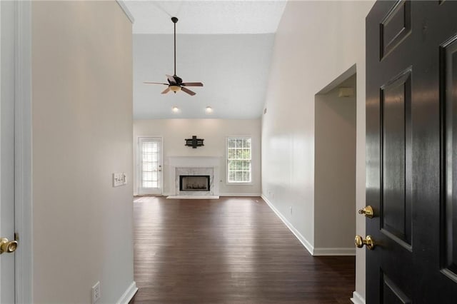 16 Kentucky Walk NE, Cartersville, GA 30121 - unfurnished living room with ceiling fan, dark wood finished floors, high vaulted ceiling, baseboards, and a high end fireplace