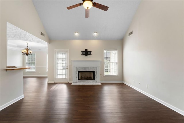 16 Kentucky Walk NE, Cartersville, GA 30121 - unfurnished living room with lofted ceiling, ceiling fan, healthy amount of natural light, a chandelier, and a premium fireplace