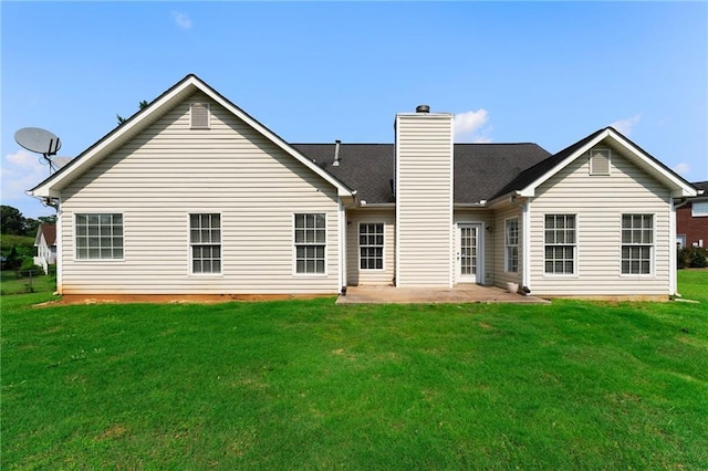 16 Kentucky Walk NE, Cartersville, GA 30121 - rear view of house featuring a chimney, a lawn, and a patio