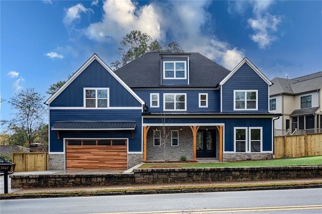 craftsman house with covered porch and a garage