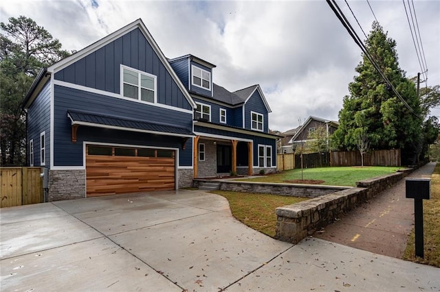 view of front of home featuring a front yard and a garage