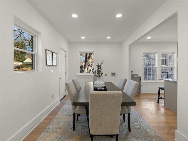 dining room featuring hardwood / wood-style floors and a healthy amount of sunlight