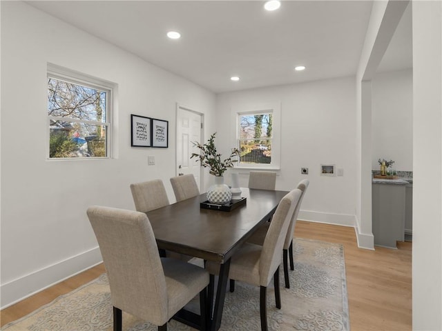 dining space featuring a healthy amount of sunlight and light wood-type flooring