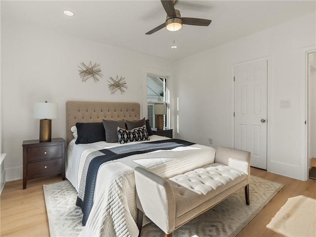 bedroom featuring ceiling fan and light hardwood / wood-style floors