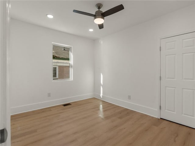 unfurnished room featuring light wood-type flooring and ceiling fan