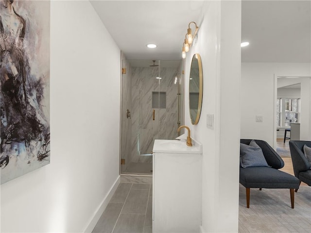 bathroom featuring tile patterned flooring, vanity, and an enclosed shower