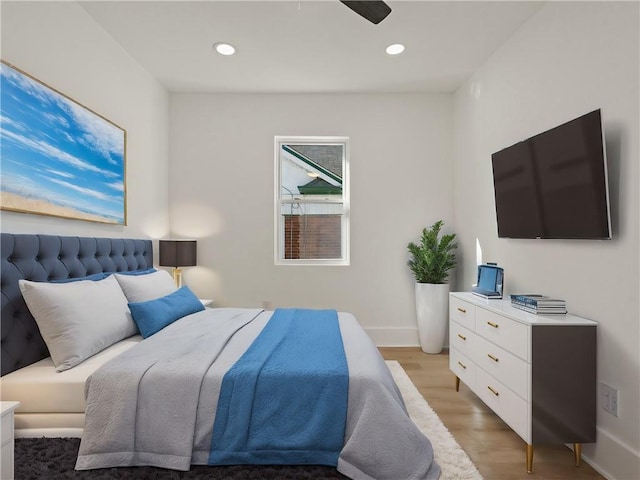 bedroom featuring ceiling fan and light hardwood / wood-style floors