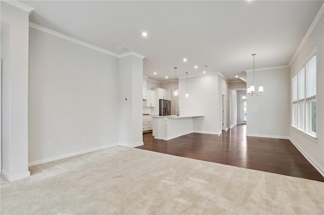 unfurnished living room with recessed lighting, a notable chandelier, dark wood-type flooring, baseboards, and dark carpet