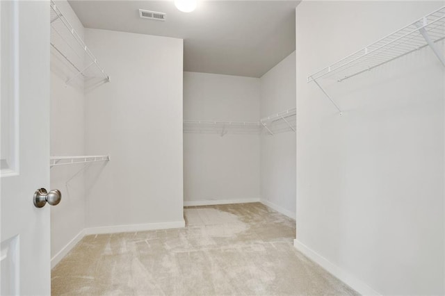 walk in closet with carpet and visible vents