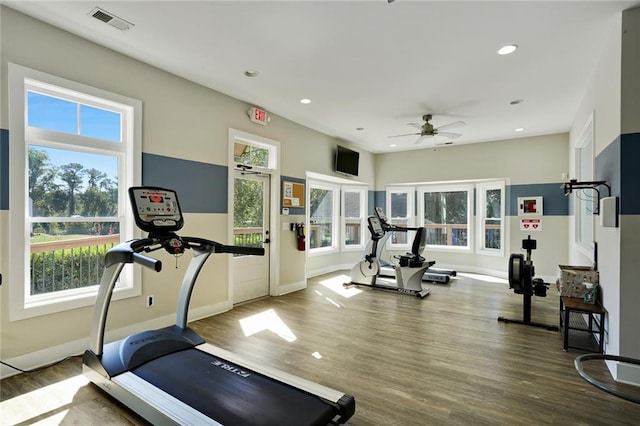 workout room with a wealth of natural light, visible vents, recessed lighting, and wood finished floors