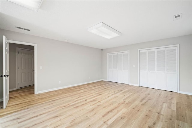 2279 Jerusalem Church Rd, Jasper, GA 30143 - unfurnished bedroom with light wood-type flooring and two closets