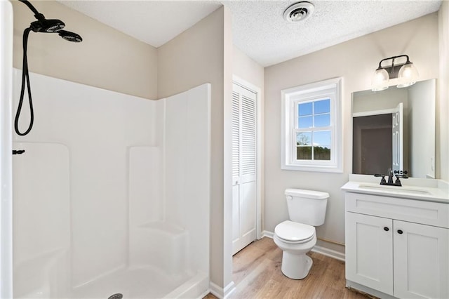 2279 Jerusalem Church Rd, Jasper, GA 30143 - bathroom with hardwood / wood-style flooring, toilet, a shower, a textured ceiling, and vanity