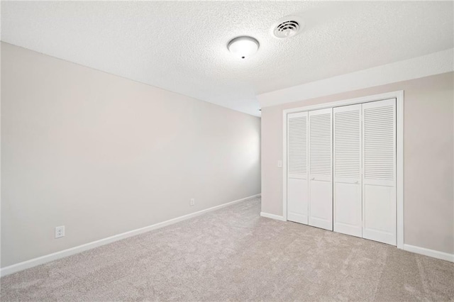 2279 Jerusalem Church Rd, Jasper, GA 30143 - unfurnished bedroom with a closet, a textured ceiling, and light colored carpet