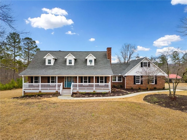 view of front facade with covered porch and a front lawn