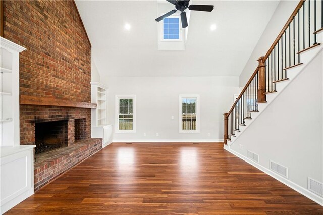 2279 Jerusalem Church Rd, Jasper, GA 30143 - unfurnished living room with high vaulted ceiling, ceiling fan, dark hardwood / wood-style flooring, a brick fireplace, and built in features