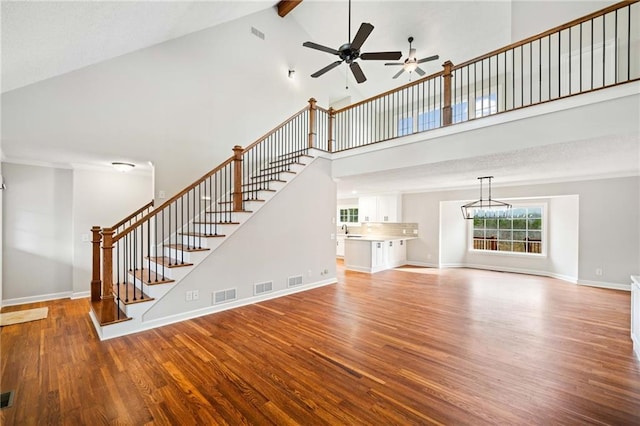 2279 Jerusalem Church Rd, Jasper, GA 30143 - unfurnished living room featuring wood-type flooring, sink, ceiling fan, high vaulted ceiling, and beam ceiling