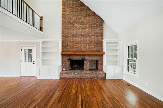 2279 Jerusalem Church Rd, Jasper, GA 30143 - unfurnished living room featuring a fireplace, high vaulted ceiling, and wood-type flooring