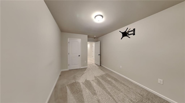 empty room featuring light colored carpet