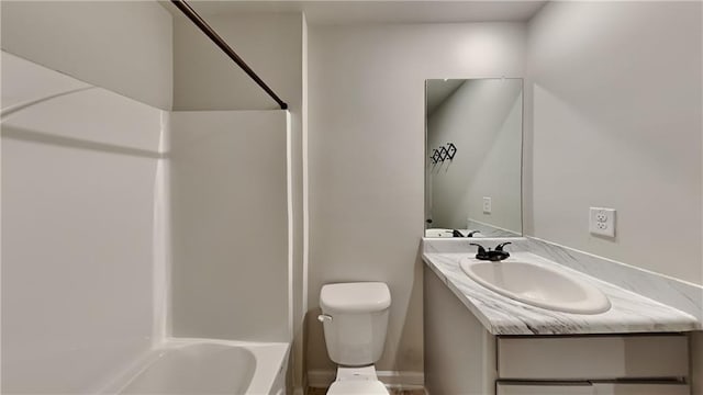 full bathroom with vanity, tub / shower combination, and toilet