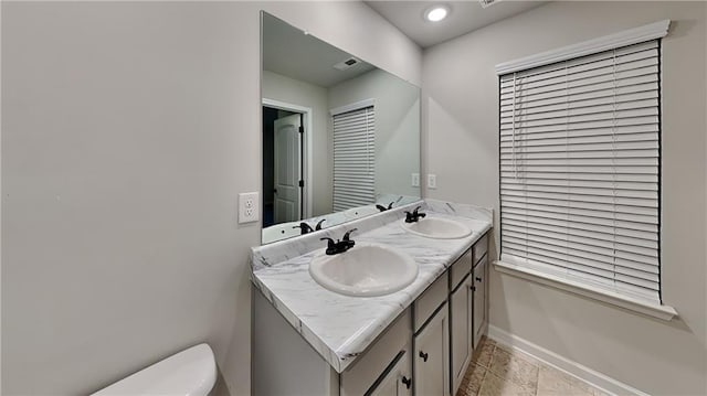 bathroom with vanity and toilet