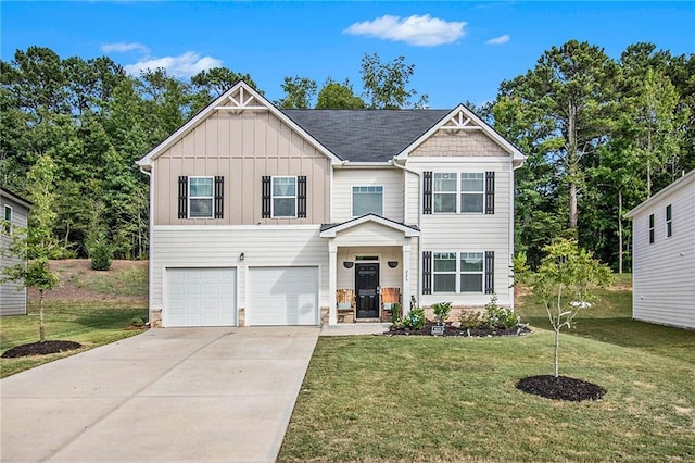 view of front of property with a garage and a front lawn