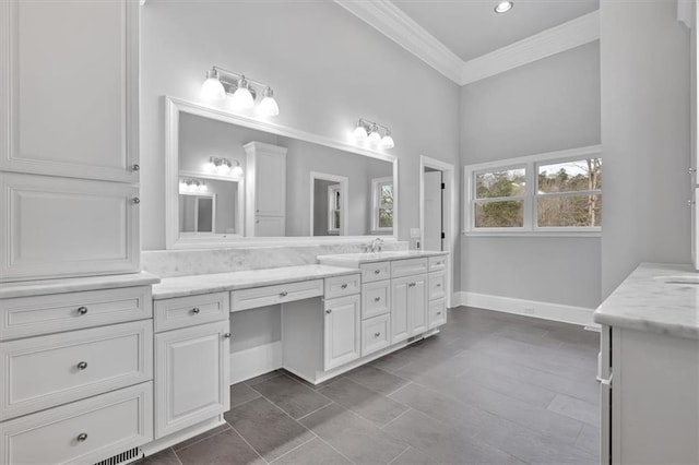 full bathroom with vanity, baseboards, and ornamental molding