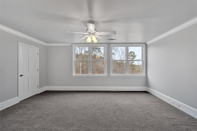 unfurnished room with dark colored carpet, visible vents, baseboards, and crown molding