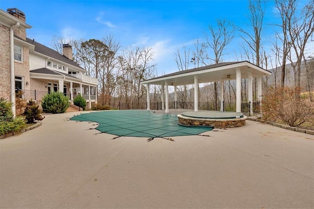 view of swimming pool featuring a fenced in pool, a patio, and fence