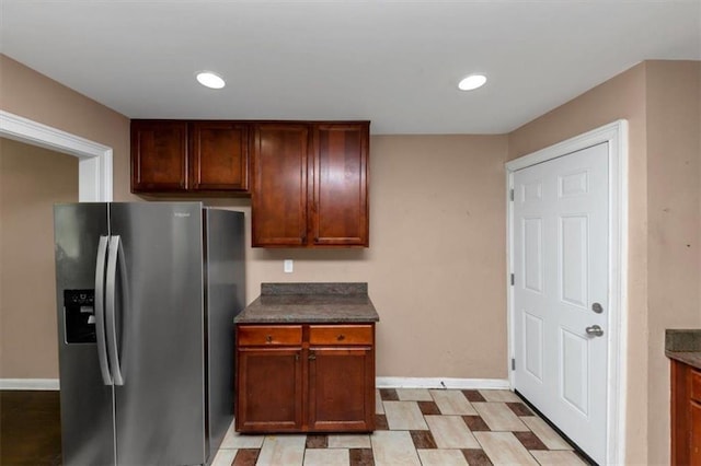 2702 Rollingwood Ln SE, Atlanta, GA 30316 - kitchen with stainless steel fridge, dark countertops, and recessed lighting