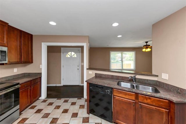 2702 Rollingwood Ln SE, Atlanta, GA 30316 - kitchen with appliances with stainless steel finishes, dark countertops, ceiling fan, recessed lighting, and light flooring