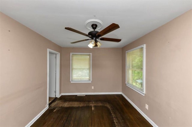 2702 Rollingwood Ln SE, Atlanta, GA 30316 - spare room featuring hardwood / wood-style flooring, healthy amount of natural light, and a ceiling fan