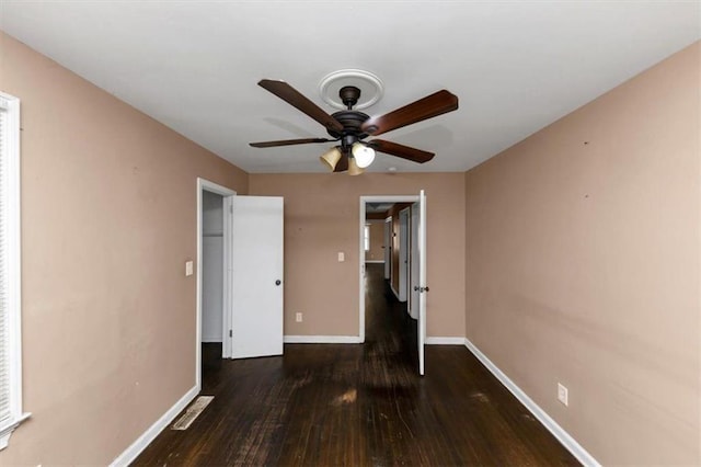 2702 Rollingwood Ln SE, Atlanta, GA 30316 - unfurnished bedroom with wood-type flooring and a ceiling fan