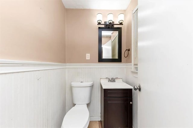 2702 Rollingwood Ln SE, Atlanta, GA 30316 - half bathroom with wainscoting and vanity