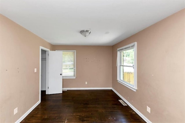 2702 Rollingwood Ln SE, Atlanta, GA 30316 - unfurnished bedroom featuring wood finished floors and baseboards