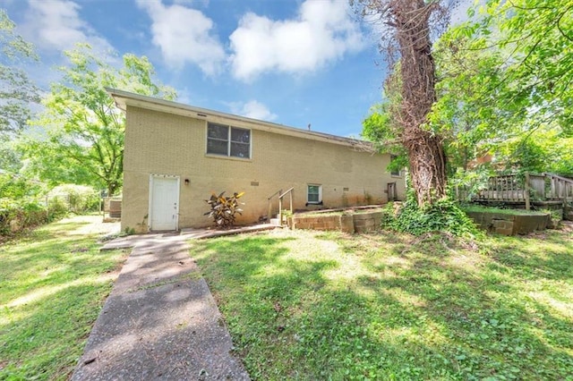 2702 Rollingwood Ln SE, Atlanta, GA 30316 - back of house featuring a lawn and brick siding