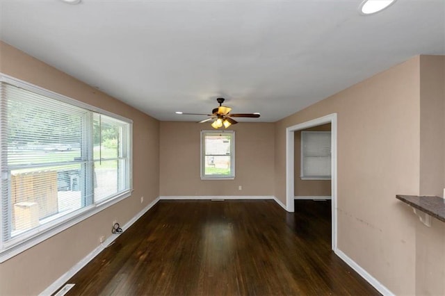 2702 Rollingwood Ln SE, Atlanta, GA 30316 - unfurnished room with dark wood-style flooring, plenty of natural light, and ceiling fan