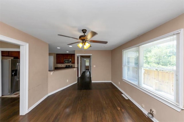 2702 Rollingwood Ln SE, Atlanta, GA 30316 - unfurnished living room featuring dark wood-style floors, a ceiling fan, and recessed lighting