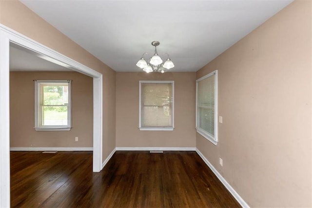 2702 Rollingwood Ln SE, Atlanta, GA 30316 - unfurnished dining area with a chandelier and wood finished floors